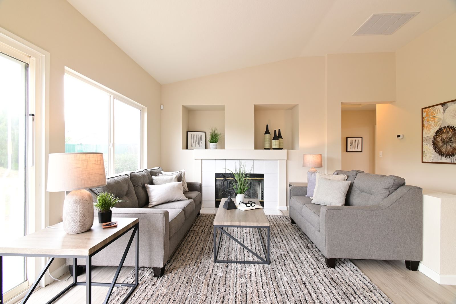 AI + human real estate photo editing of a living room before
