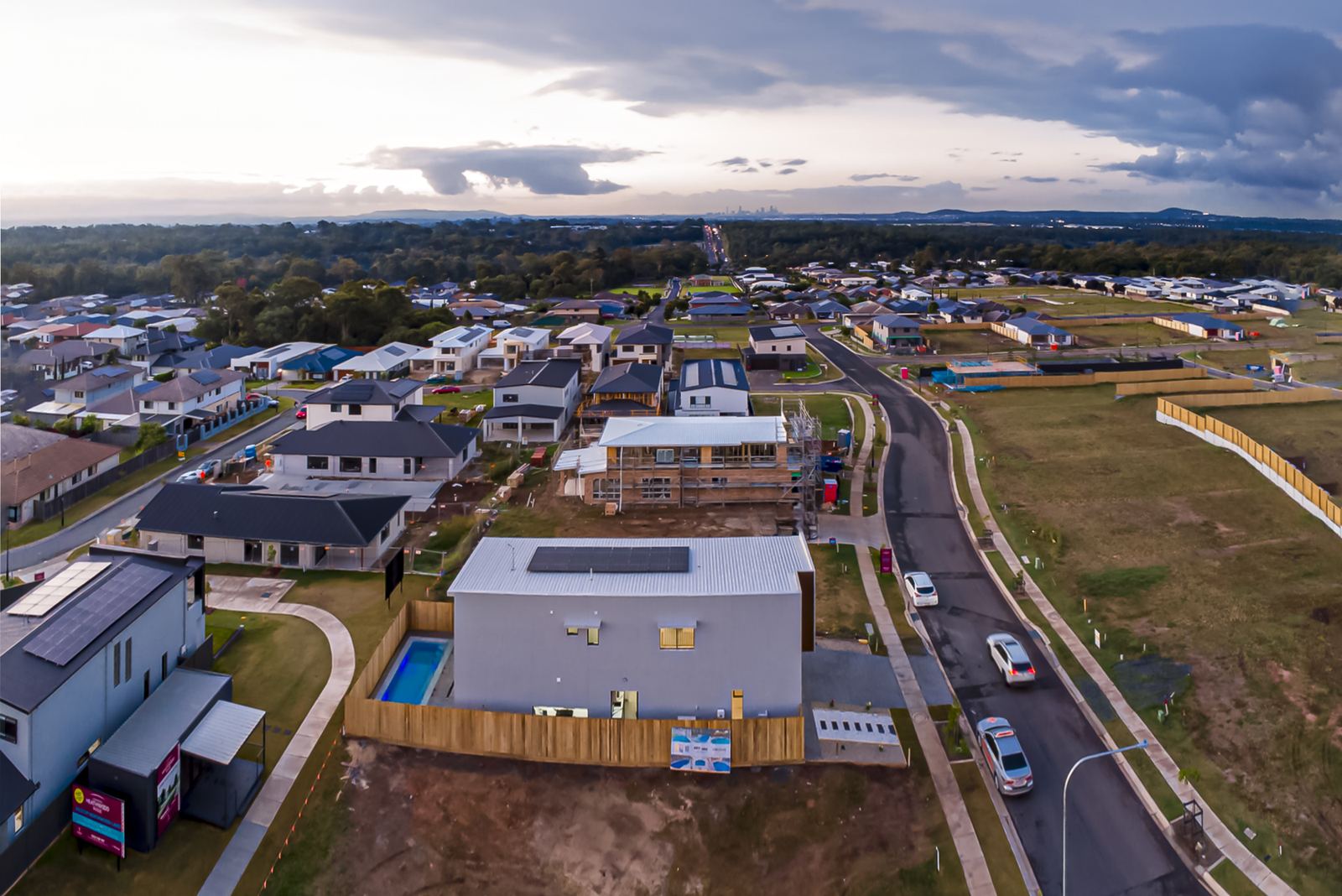 Day to dusk conversion of an aerial estate photo before