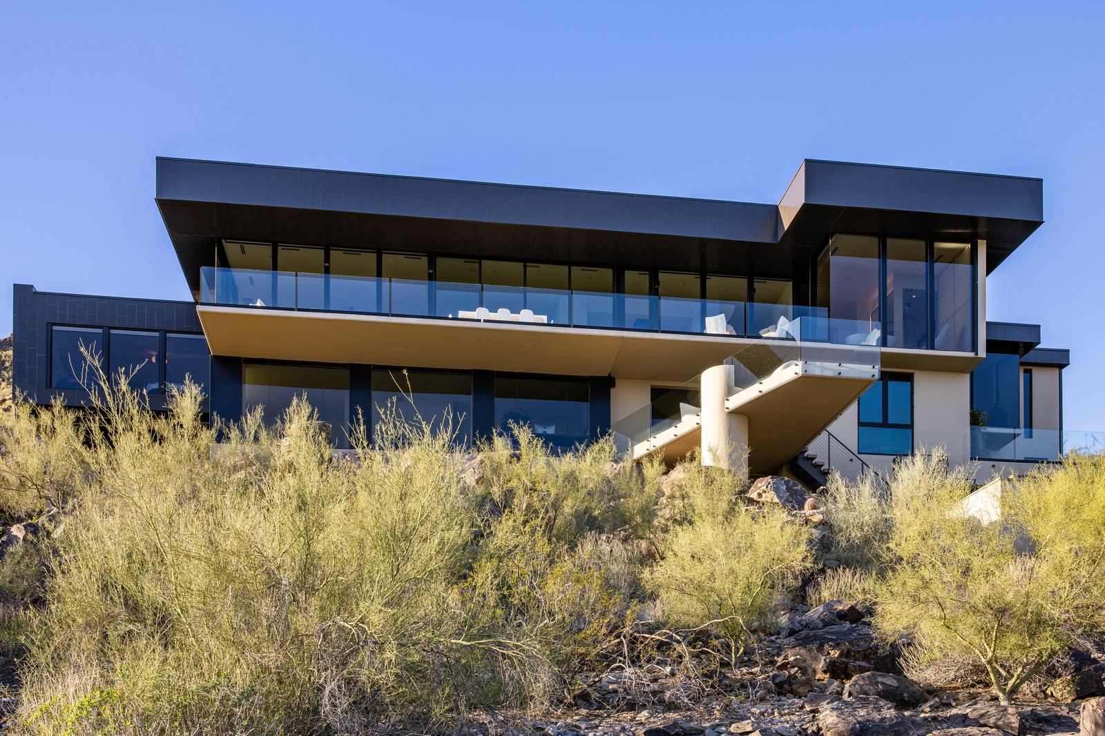 Twilight conversion of a modern house exterior before