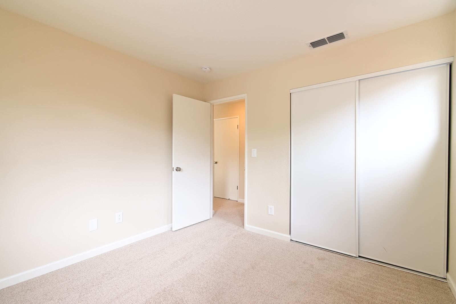 High-end manual real estate photo editing of a living room before