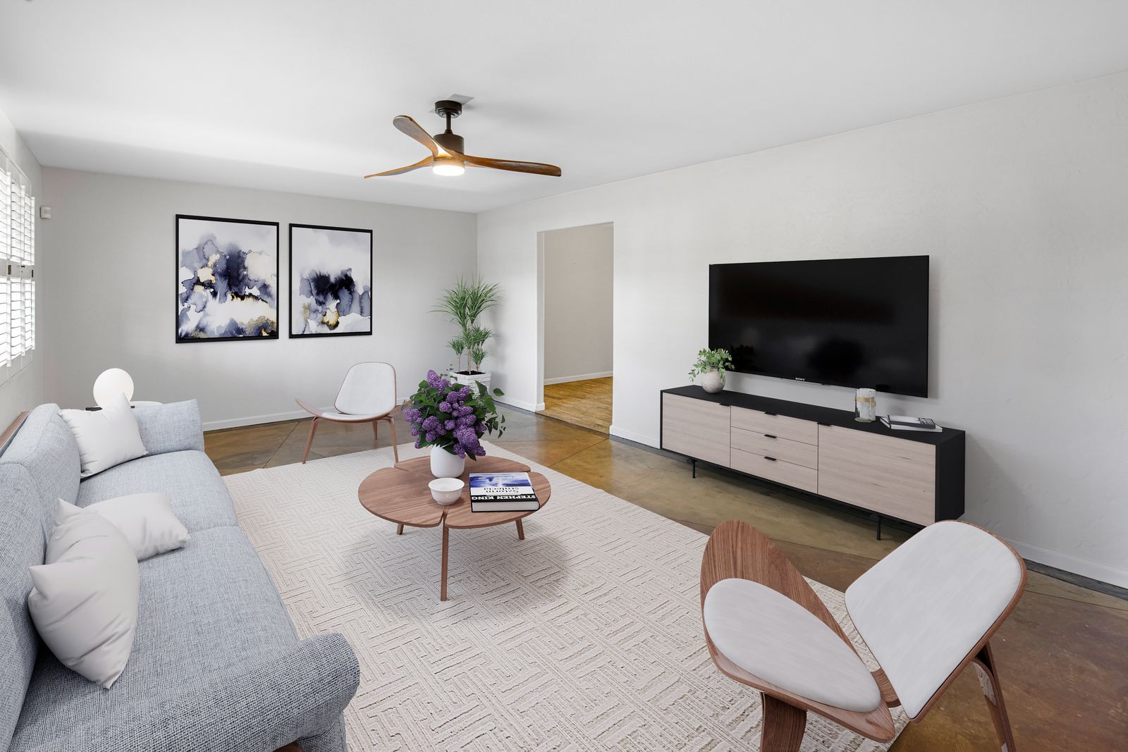 Virtual staging of an empty living room with digital furniture after